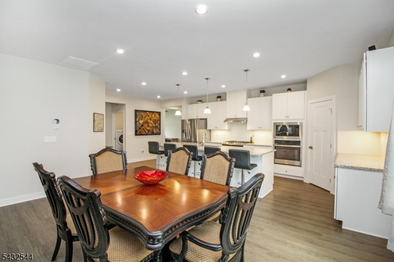 21 Harris Hawk Road Washington, NJ 07882 - Photo 9 of 26 a view of a dining room with furniture and wooden floor