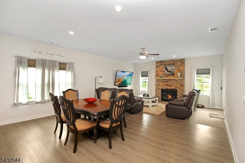 21 Harris Hawk Road Washington, NJ 07882 - Photo 10 of 26 a view of a dining room with furniture window and wooden floor