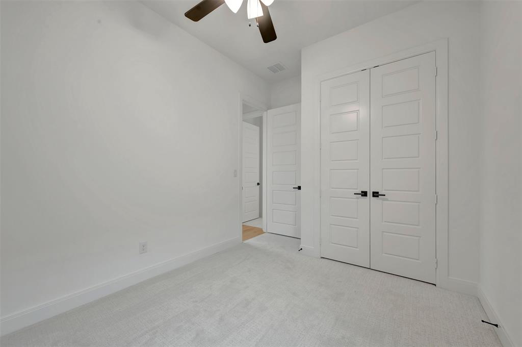 1856 Lightner Road Van Alstyne, TX 75495 - Photo 33 of 33 Spacious interior room featuring light gray carpeting and white baseboards
