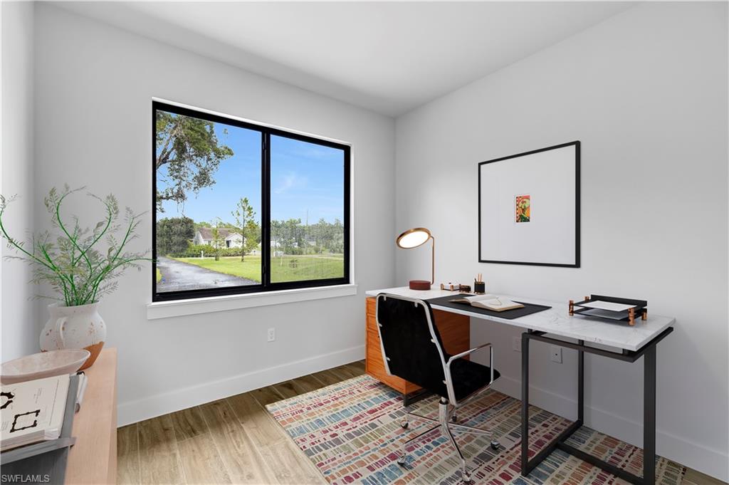 4263 18th Avenue Southeast Naples, FL 34117 - Photo 19 of 23 a view of a workspace with furniture and a window