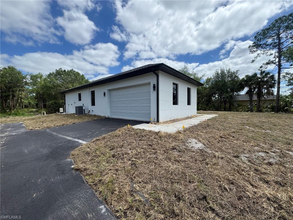 4263 18th Avenue Southeast Naples, FL 34117 - Photo 4 of 23 a house with a outdoor space