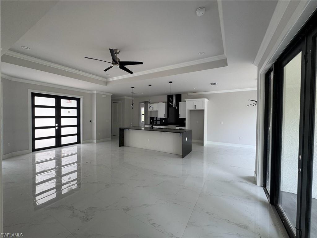 4263 18th Avenue Southeast Naples, FL 34117 - Photo 6 of 23 a view of a kitchen with a sink and cabinet area
