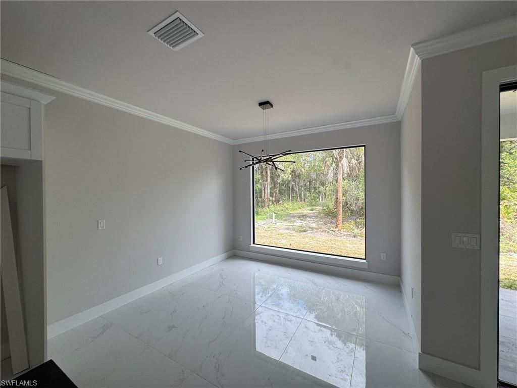 4263 18th Avenue Southeast Naples, FL 34117 - Photo 8 of 23 a view of an empty room with a window