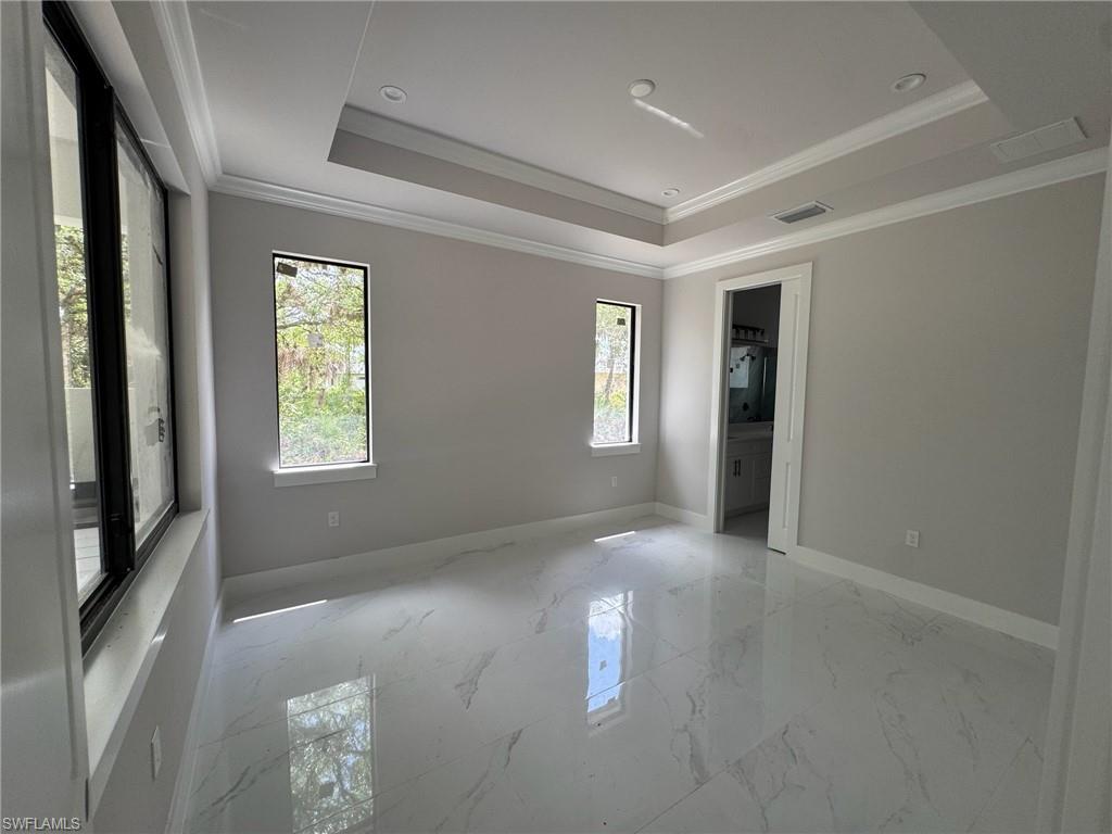 4263 18th Avenue Southeast Naples, FL 34117 - Photo 9 of 23 a view of empty room with windows