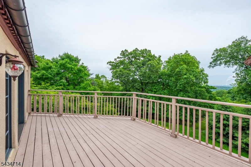 50 Rock Spring Road West Orange, NJ 07052 - Photo 24 of 50 a balcony with wooden floor and trees in the background