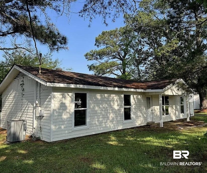 22915 High Ridge Road Fairhope, AL 36532 - Photo 2 of 3 View of home's exterior featuring a yard