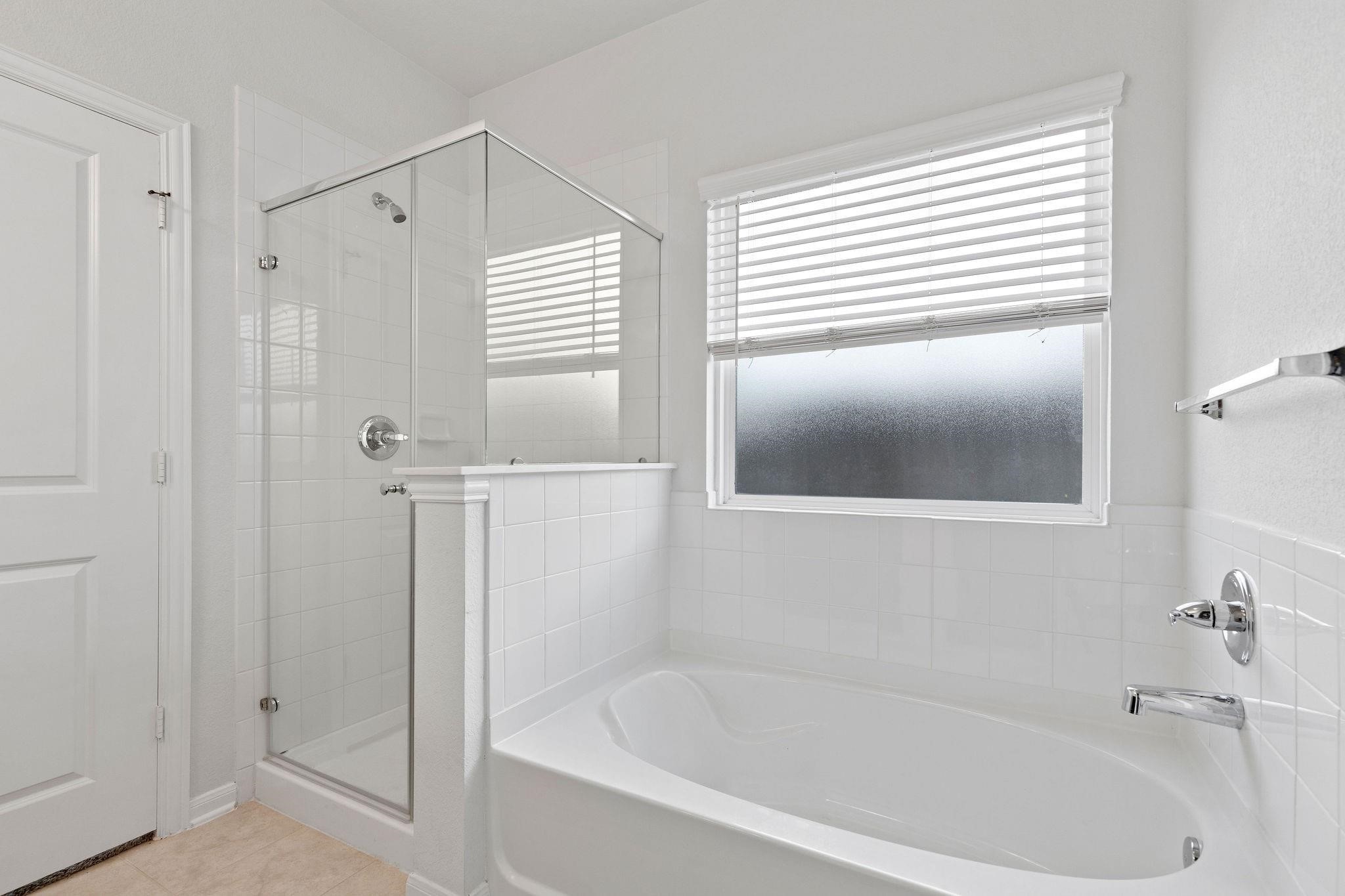 5319 Rivers Edge Drive Richmond, TX 77469 - Photo 13 of 23 a white bath tub sitting next to a window