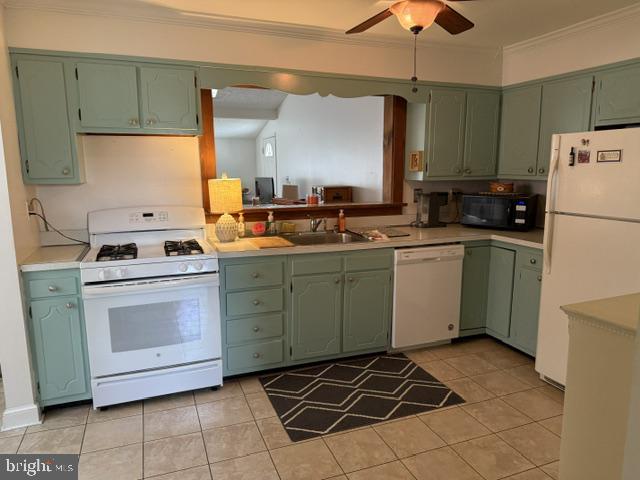 6117 Auth Road Suitland, MD 20746 - Photo 5 of 7 a kitchen with a stove sink and cabinets