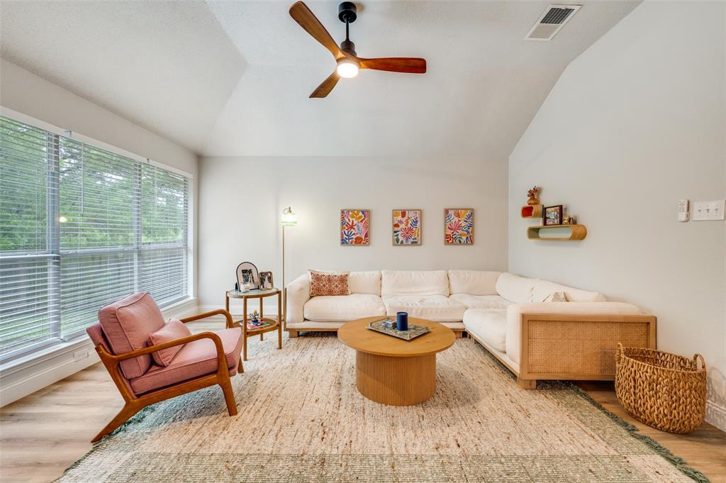 7306 Vista Ridge Lane Sachse, TX 75048 - Photo 10 of 23 a living room with furniture a rug and a large window