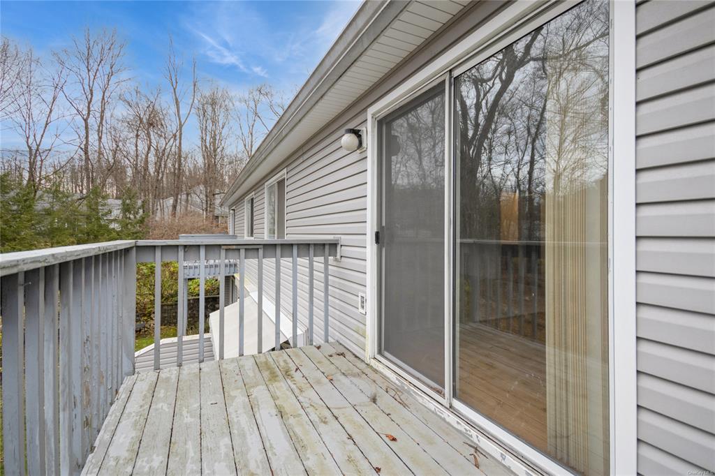 148 Flintlock Way, Unit E Yorktown Heights, NY 10598 - Photo 19 of 27 View of wooden deck