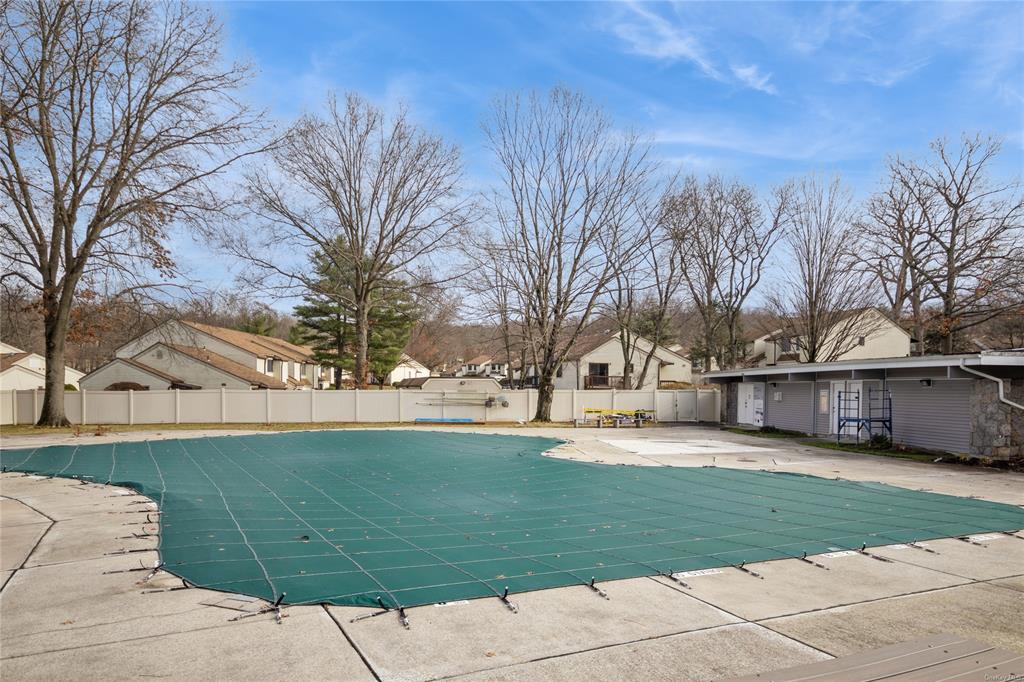 148 Flintlock Way, Unit E Yorktown Heights, NY 10598 - Photo 24 of 27 View of swimming pool with a patio area