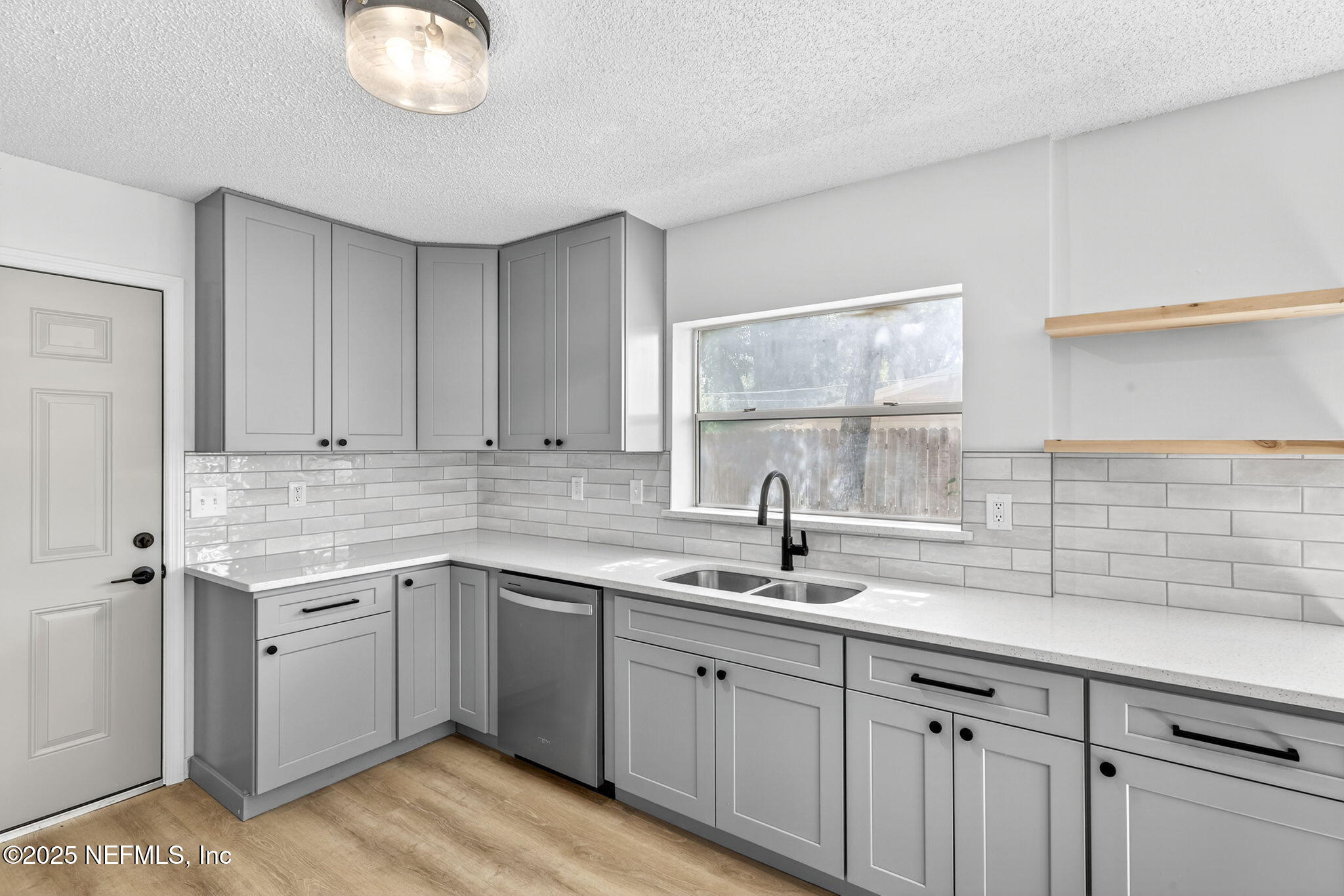 258 Wisteria Road St. Augustine, FL 32086 - Photo 12 of 33 a kitchen with a sink cabinets and window