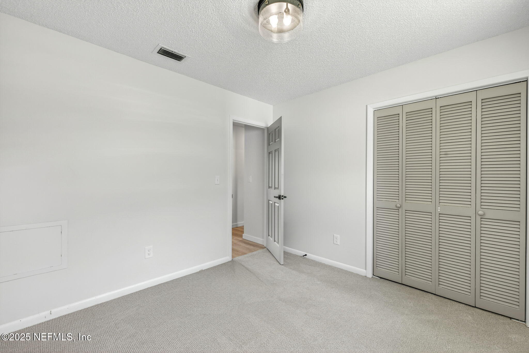 258 Wisteria Road St. Augustine, FL 32086 - Photo 23 of 33 an empty room with windows