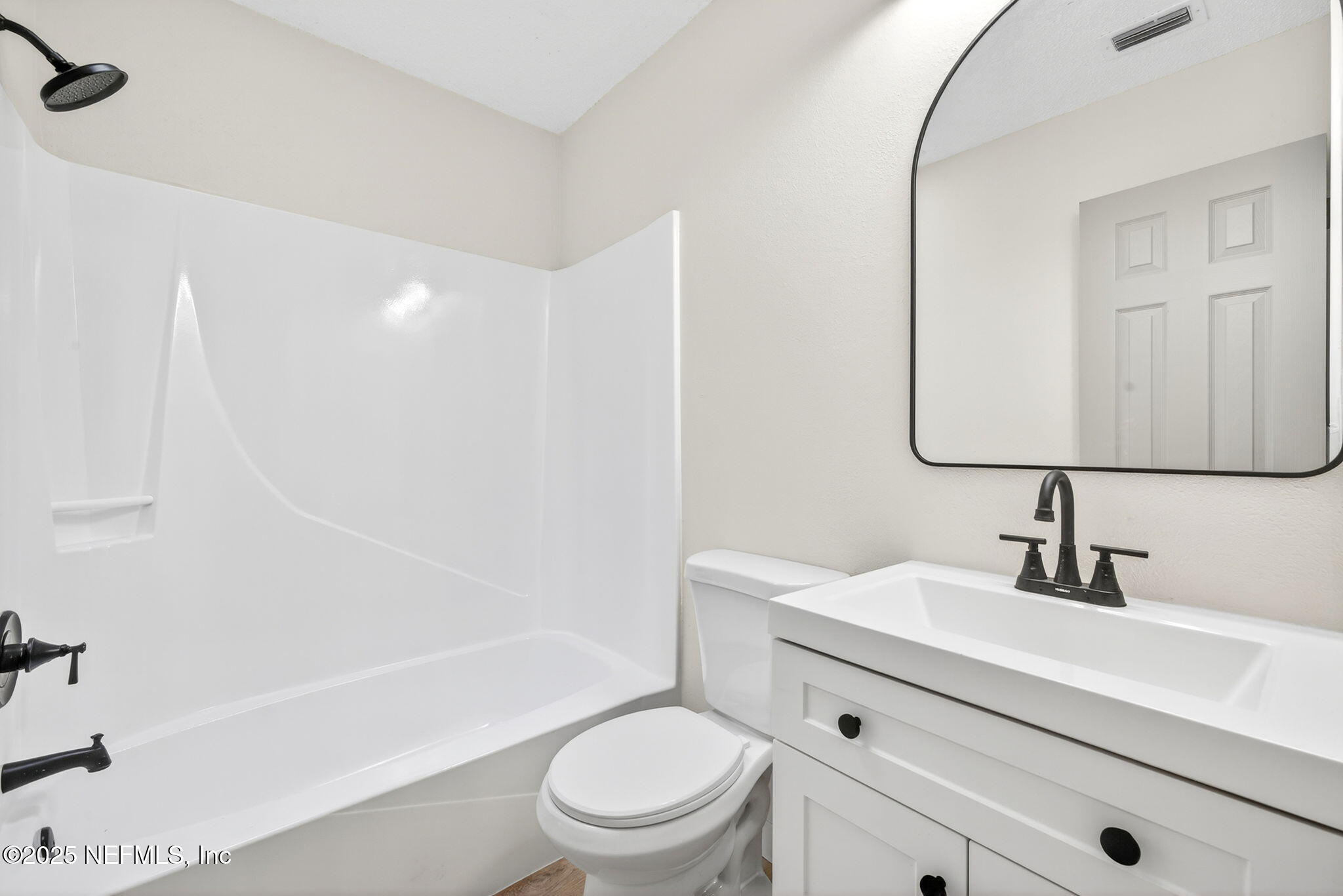 258 Wisteria Road St. Augustine, FL 32086 - Photo 24 of 33 a bathroom with a sink a toilet a mirror and shower