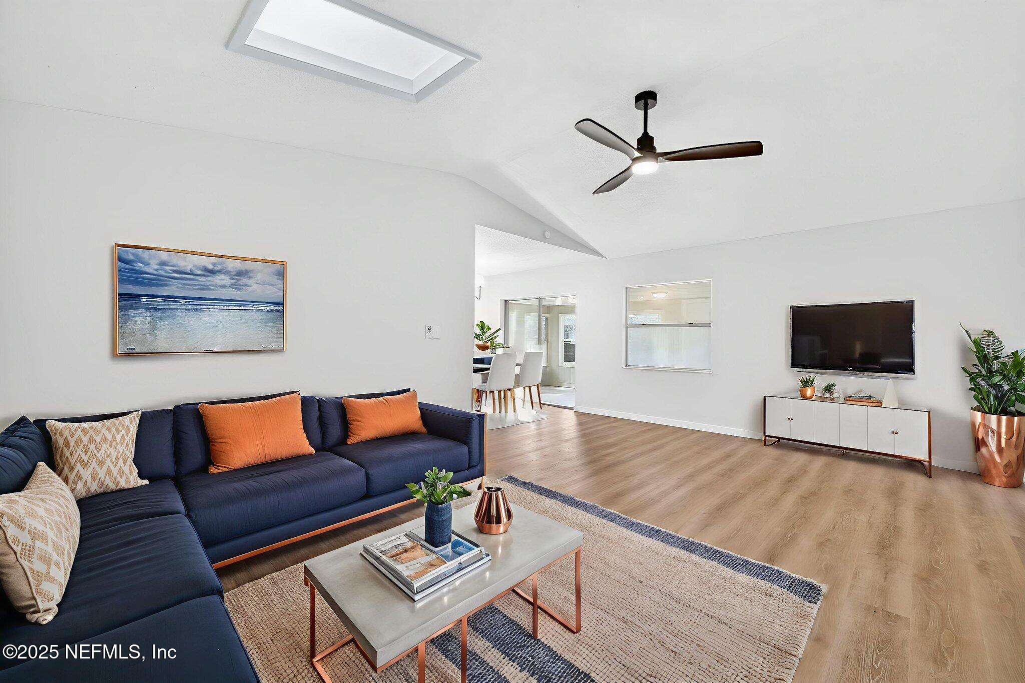 258 Wisteria Road St. Augustine, FL 32086 - Photo 6 of 33 a living room with furniture and a flat screen tv
