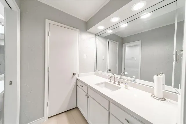 a bathroom with a sink double vanity and a mirror