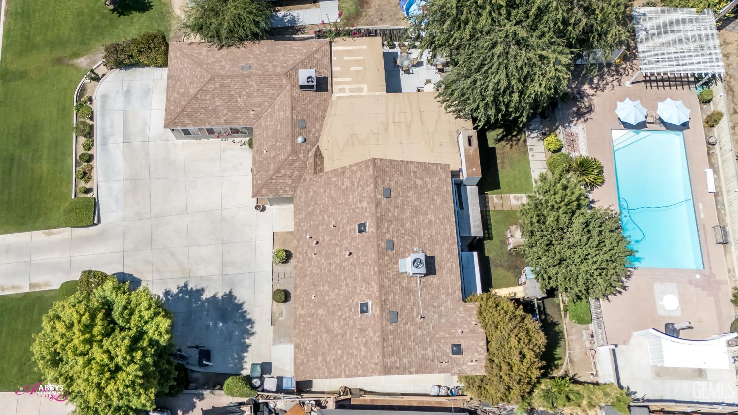 Undisclosed Address Bakersfield, CA 93306 - Photo 12 of 56 aerial view of a house with plants and flowers