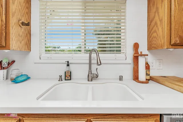 a living room with patio furniture and a window