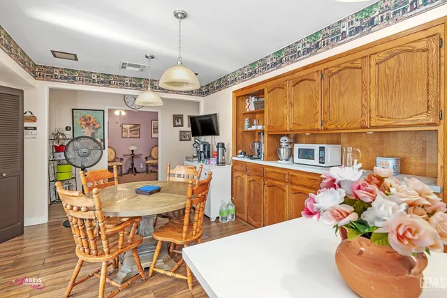 a living room with fireplace furniture and a large window