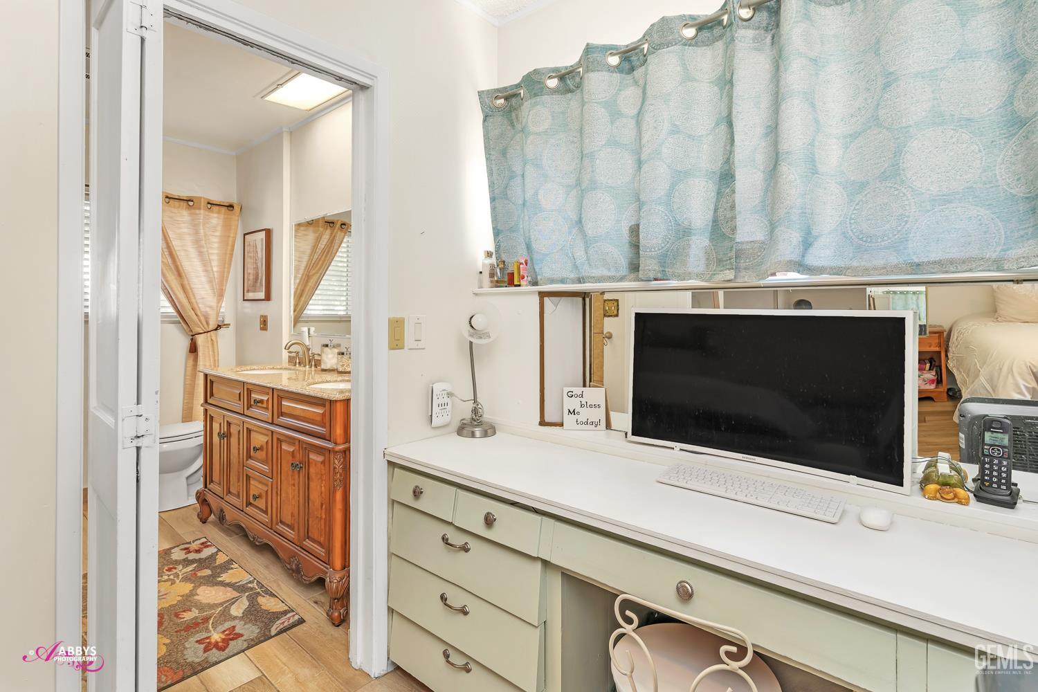 Undisclosed Address Bakersfield, CA 93306 - Photo 29 of 56 a bathroom with a sink a mirror and a shower