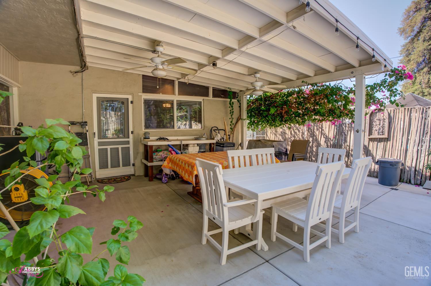 Undisclosed Address Bakersfield, CA 93306 - Photo 38 of 56 a dining space with a table and chairs
