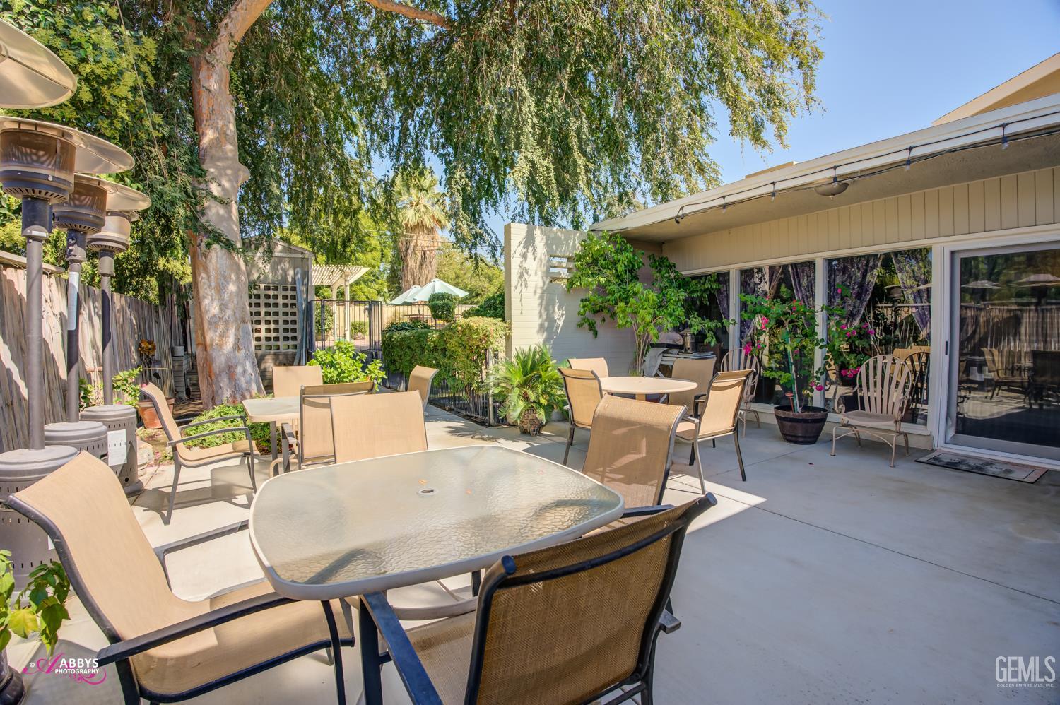 Undisclosed Address Bakersfield, CA 93306 - Photo 39 of 56 a view of a patio with table and chairs and potted plants