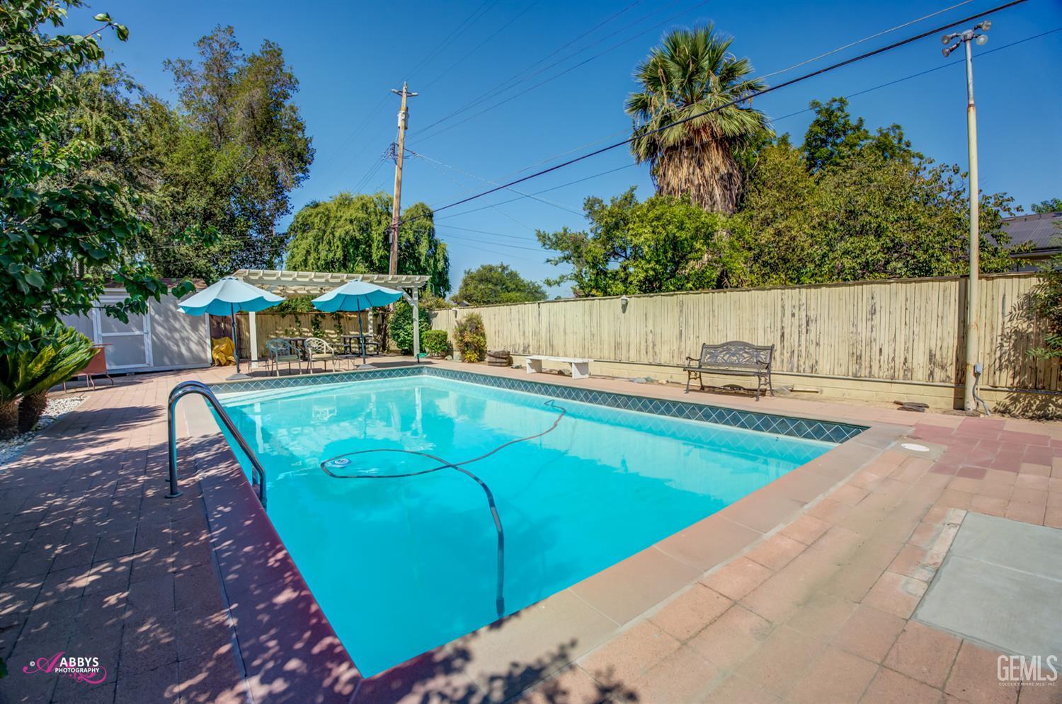 Undisclosed Address Bakersfield, CA 93306 - Photo 45 of 56 a view of a swimming pool with a patio
