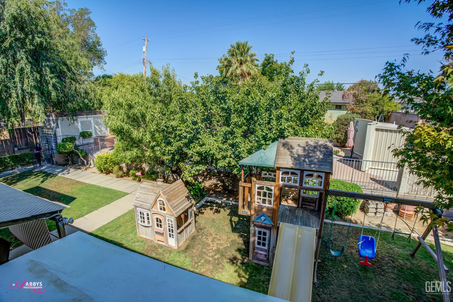 Undisclosed Address Bakersfield, CA 93306 - Photo 54 of 56 an aerial view of a house with swimming pool garden and patio