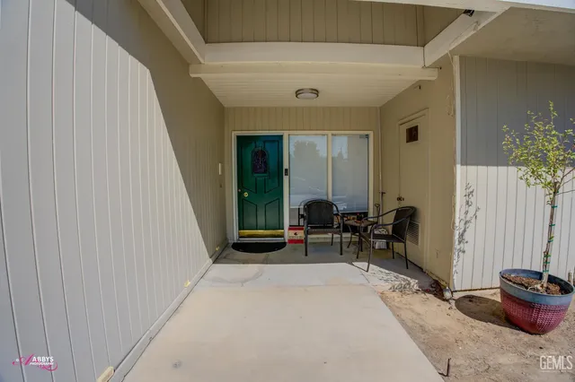 a front view of a house with a yard table and chairs