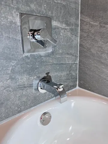 a kitchen with a stove a sink and a refrigerator