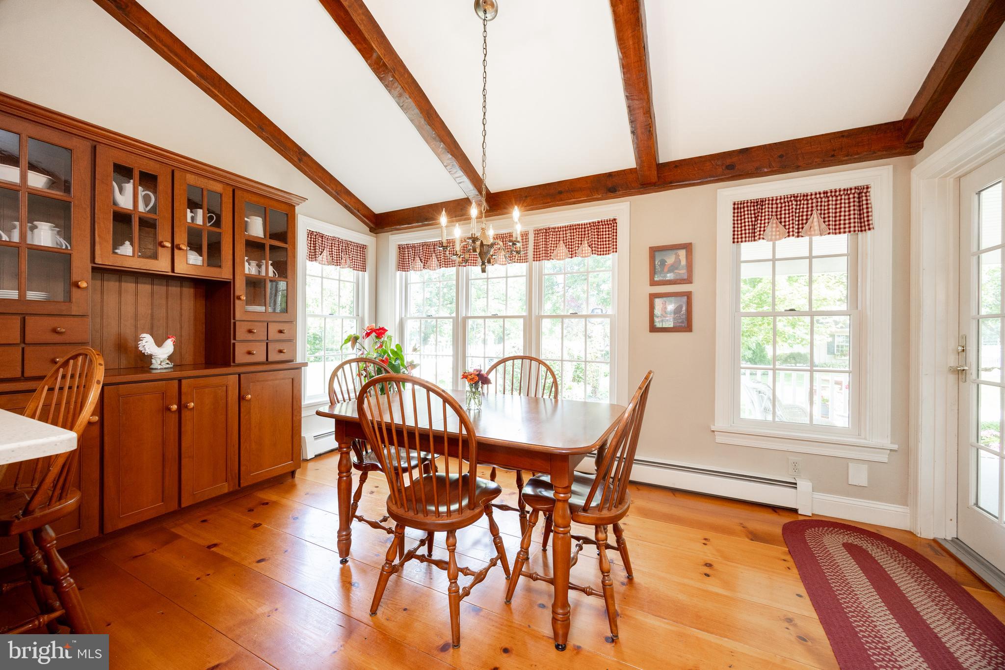 741 Cowpath Road Telford, PA 18969 - Photo 14 of 72 a dining room with furniture a chandelier and wooden floor