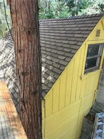 a view of a balcony with wooden floor