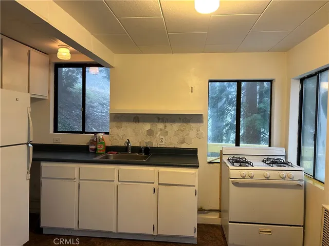 a kitchen with a sink and cabinets