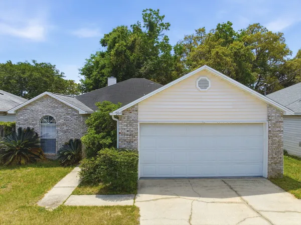 a view of a back yard of the house