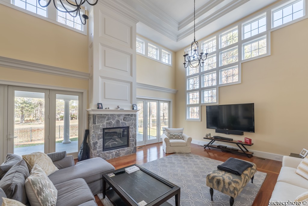44 Pleasant Park Drive Mashpee, MA 02649 - Photo 2 of 14 a living room with furniture a flat screen tv and a fireplace