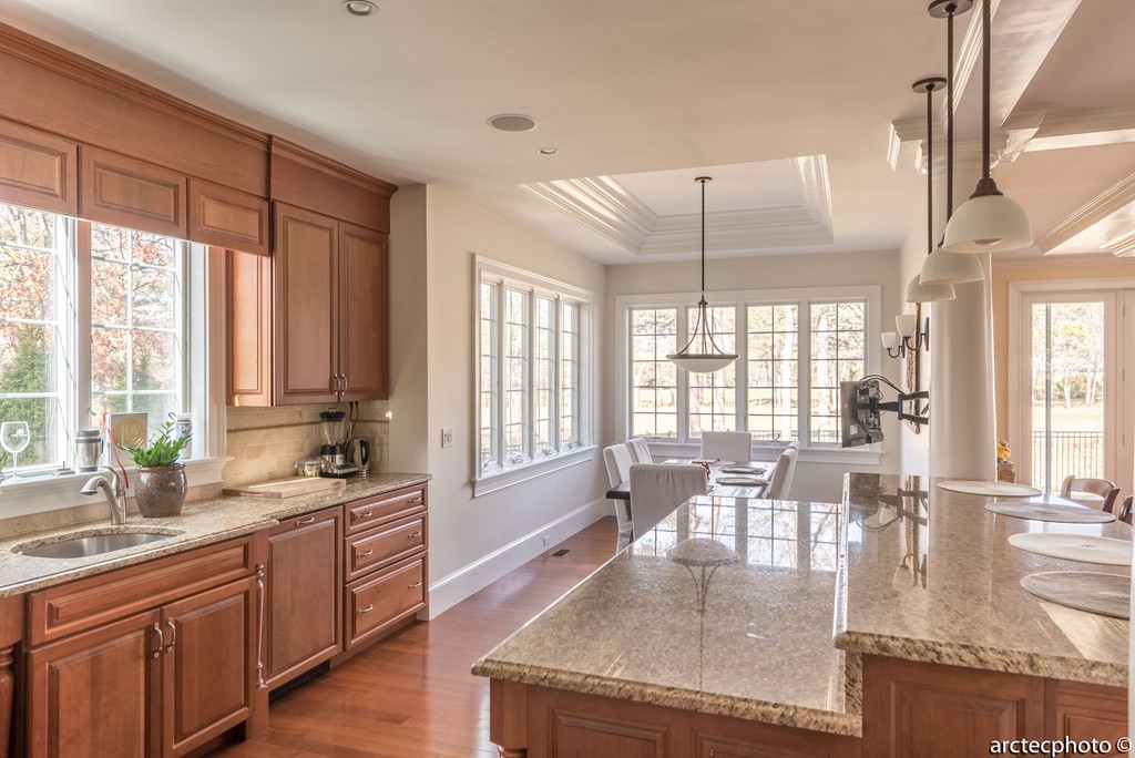 44 Pleasant Park Drive Mashpee, MA 02649 - Photo 4 of 14 a large kitchen with kitchen island a large window in it