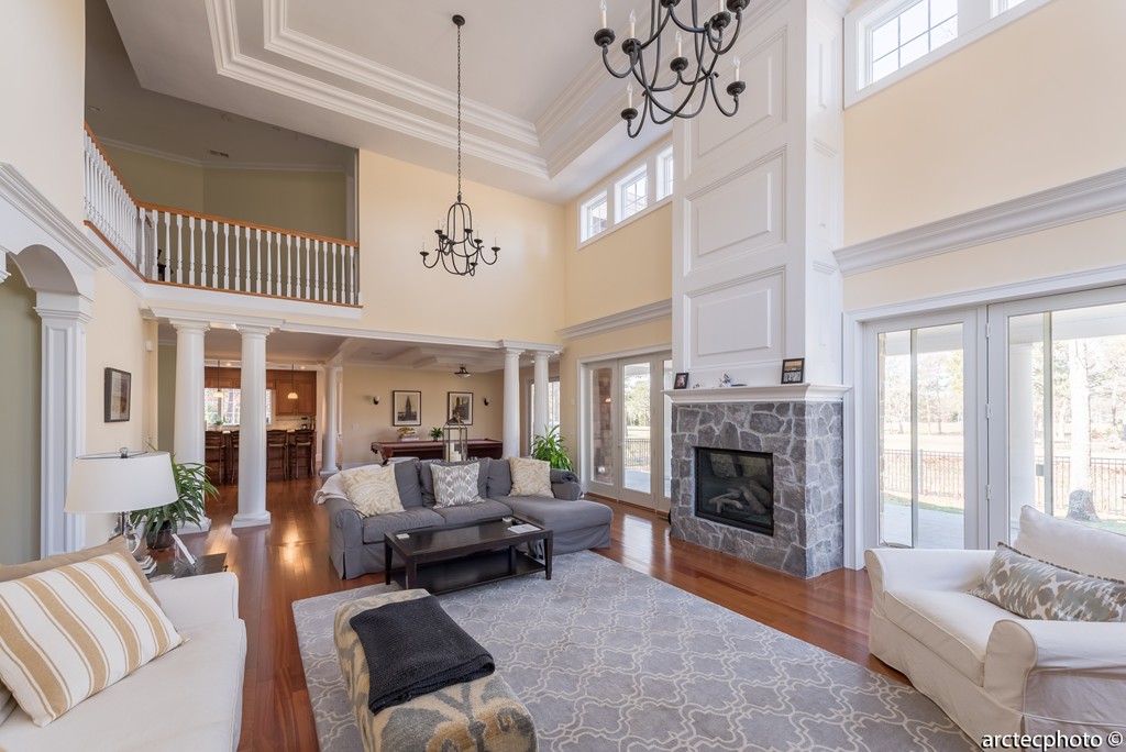 44 Pleasant Park Drive Mashpee, MA 02649 - Photo 5 of 14 a living room with furniture a fireplace and a chandelier