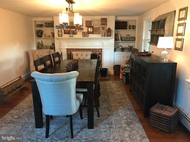 4627 Steltz Road New Freedom, PA 17349 - Photo 7 of 29 Dining room as you enter w/Wood floors & Fireplace