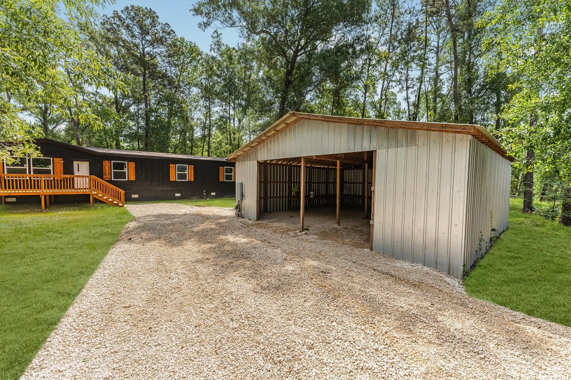 16465 Hickory Road Conroe, TX 77302 - Photo 12 of 42 front view of a house with a yard