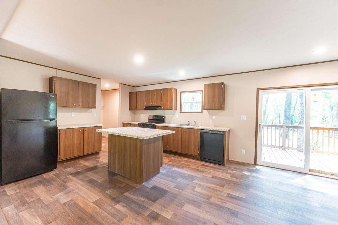 16465 Hickory Road Conroe, TX 77302 - Photo 20 of 42 a large kitchen with a window and stainless steel appliances