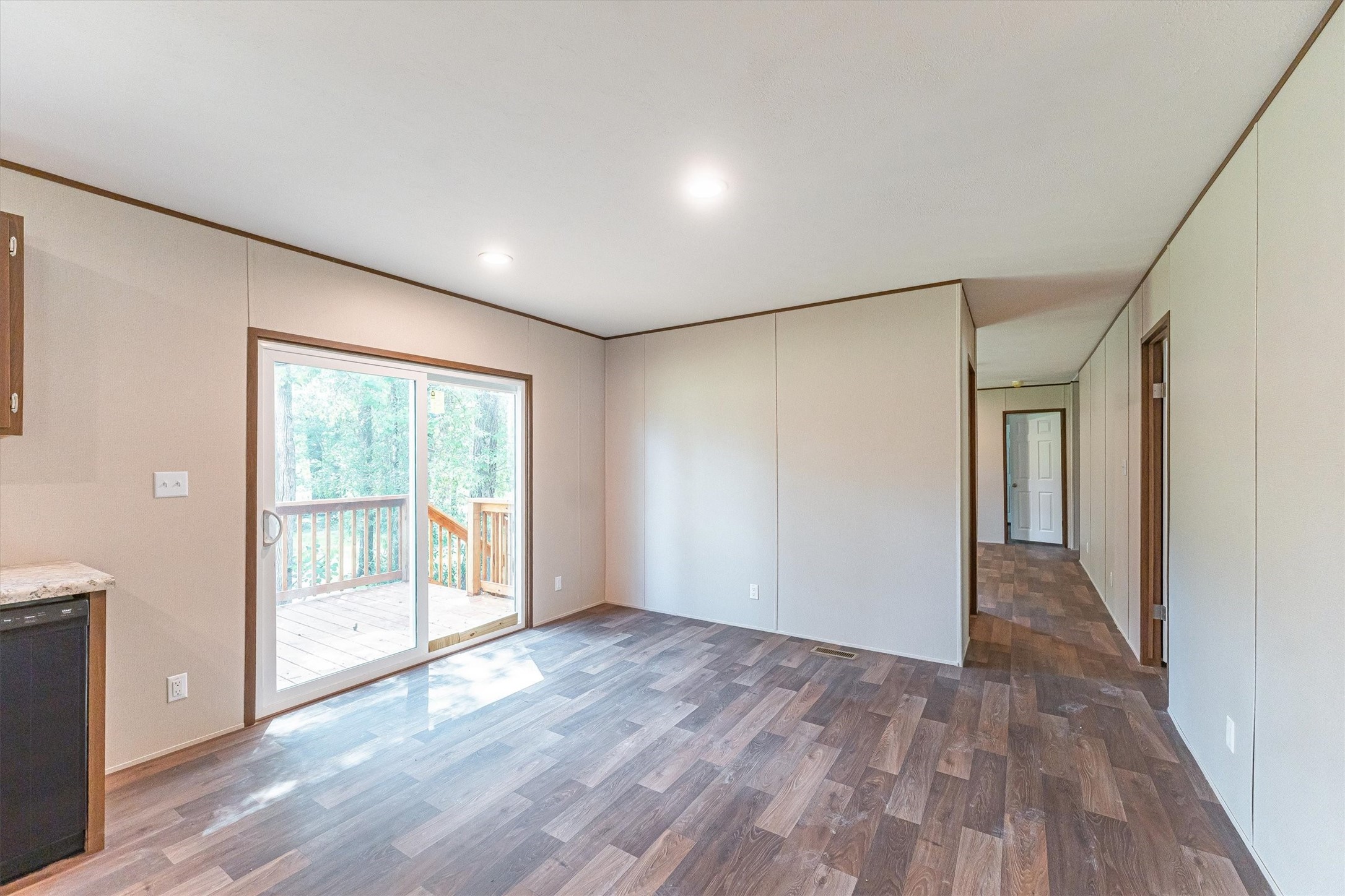 16465 Hickory Road Conroe, TX 77302 - Photo 25 of 42 a view of an empty room with wooden floor and a window