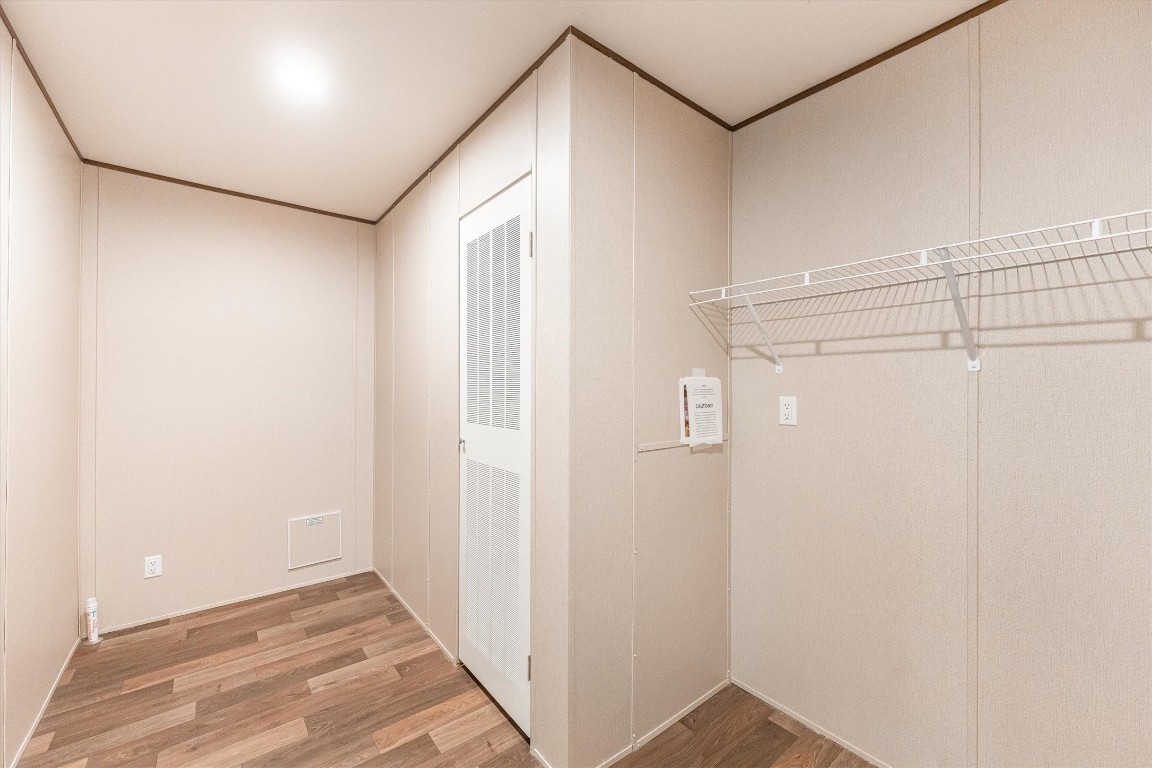 16465 Hickory Road Conroe, TX 77302 - Photo 29 of 42 a view of a hallway with wooden floor