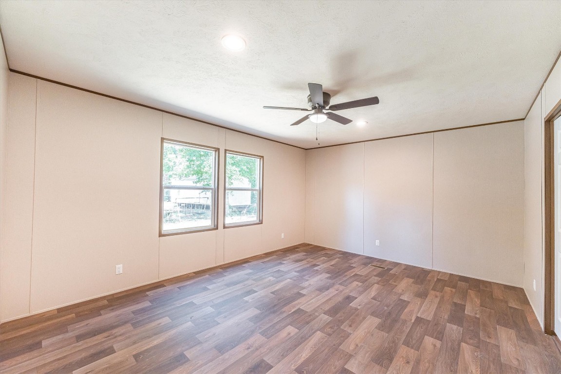 16465 Hickory Road Conroe, TX 77302 - Photo 31 of 42 a view of an empty room with a window and a ceiling fan
