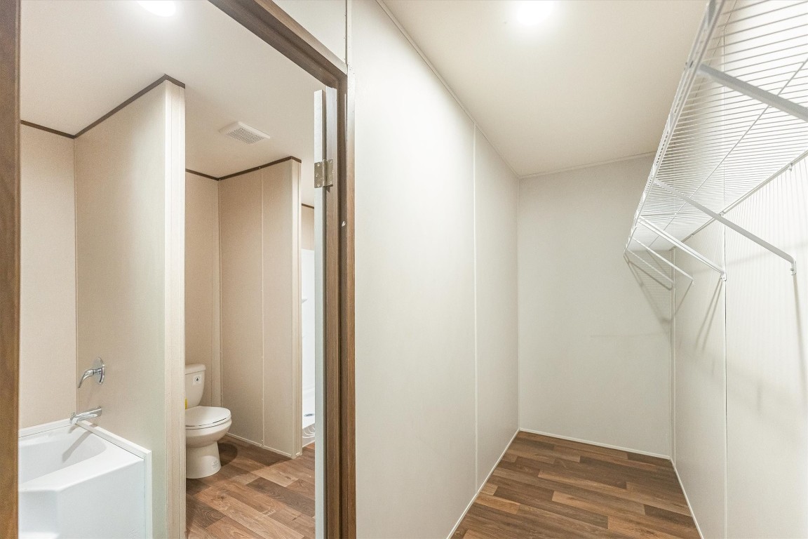 16465 Hickory Road Conroe, TX 77302 - Photo 37 of 42 a bathroom with a toilet and a shower