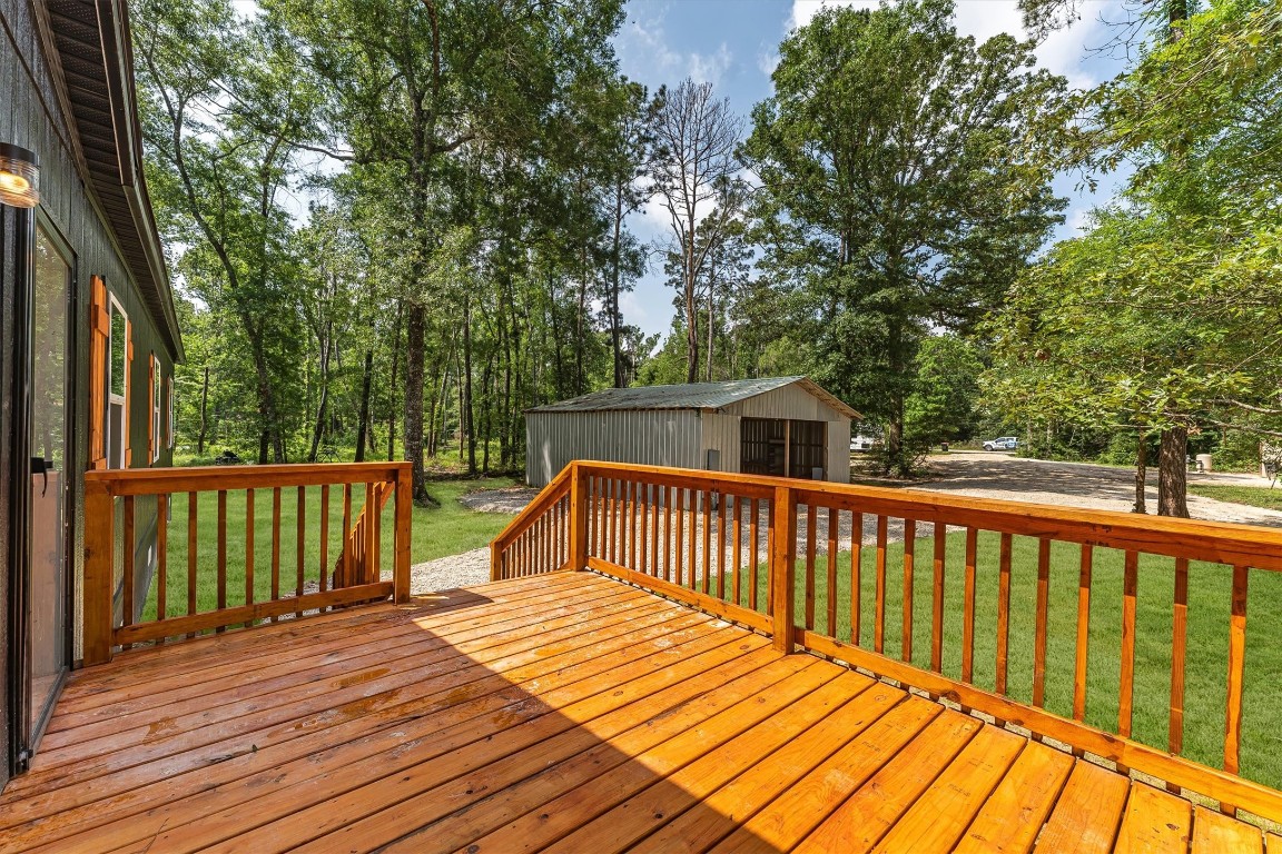 16465 Hickory Road Conroe, TX 77302 - Photo 7 of 42 a view of a wooden deck