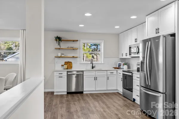 a kitchen with sink and cabinets