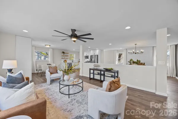 a view of kitchen with furniture and wooden floor