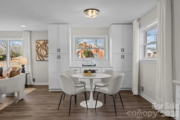 a bedroom with bed and a chandelier