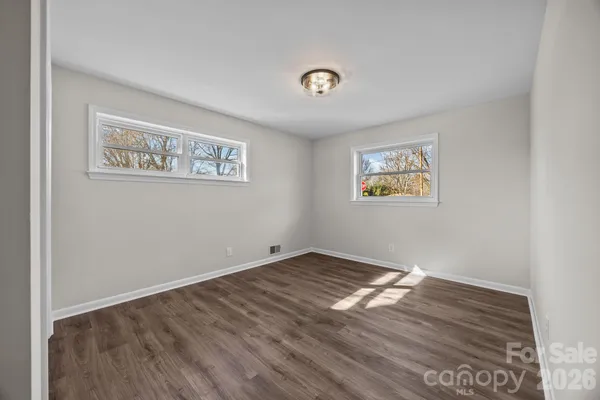 a bathroom with a shower and a toilet