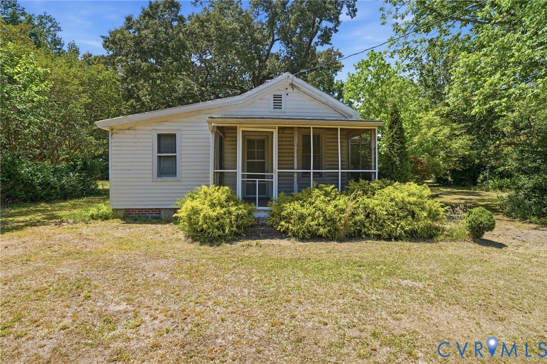 2350 Chelsea Road West Point, VA 23181 - Photo 1 of 34 a front view of a house with garden